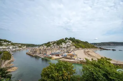 a view of a beach with houses and a town at 4 Bed in Looe oc-l30051 in Looe