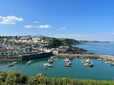 a group of boats in the water in a harbor at Holiday Home Mariners Rest by Interhome in Mevagissey