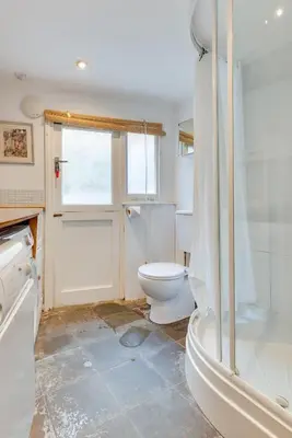 a bathroom with a toilet and a shower at 3 Bed in Fowey oc-litin in Fowey