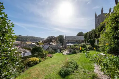 a view of a small village with a church at 3 Bed in Fowey oc-litin in Fowey