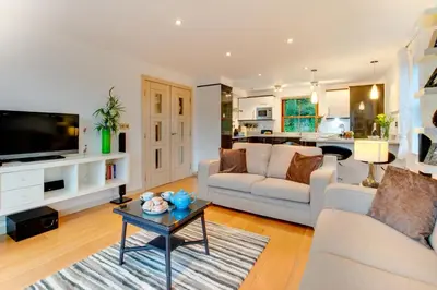 a living room with a couch and a table at 2 Bed in Looe oc-l30065 in Looe