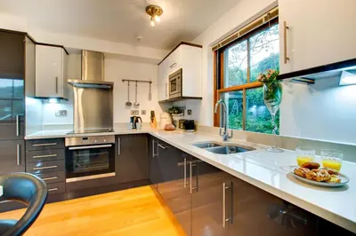 a kitchen with a plate of food on a counter at 2 Bed in Looe oc-l30065 in Looe