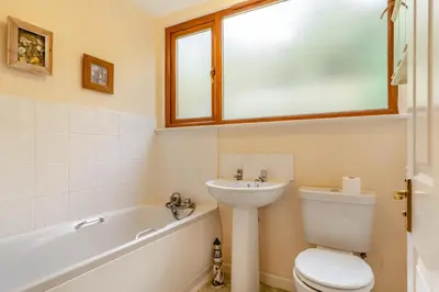 a bathroom with a toilet and a sink and a tub at 3 Bed in Looe oc-l30064 in Looe