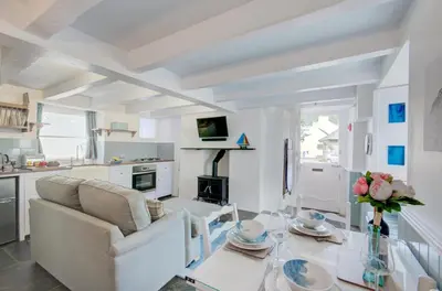 a living room with a couch and a glass table at 2 Bed in West Looe oc-l30054 in Looe