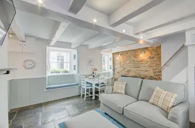 a living room with a couch and a table at 2 Bed in West Looe oc-l30054 in Looe
