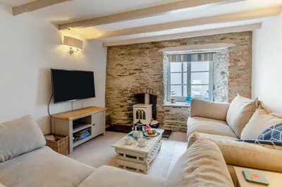 a living room with a couch and a tv at 3 Bed in Looe oc-l30053 in Looe