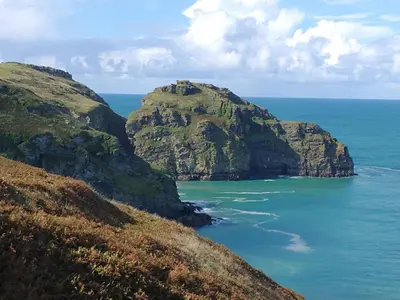 a view of the ocean between two cliffs at The Mill in Tintagel