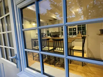 a view of a kitchen through a window at 2 Penmayne Cottage in Saint Minver