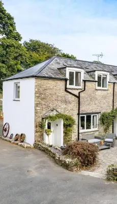 a large brick house with a white at Wykeham Coach House in Looe