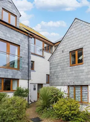a house with a gray shingled roof at Number 9, Port Isaac Bay Holidays in Port Isaac