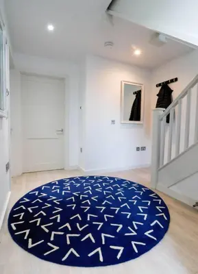 a room with a blue rug on the floor at Number 9, Port Isaac Bay Holidays in Port Isaac