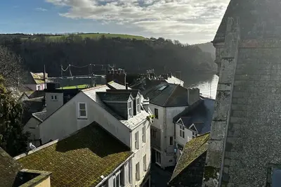 an aerial view of a city with a river and buildings at The Captain’s 4 Bed Penthouse in Fowey