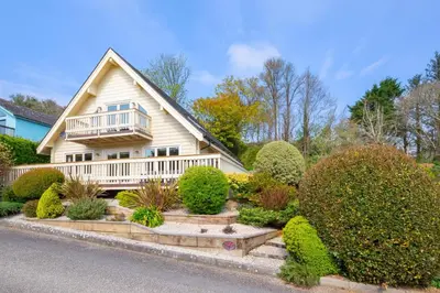 a house with a porch and bushes in front of it at 3 Bed in Little Petherick oc-maplod in Little Petherick