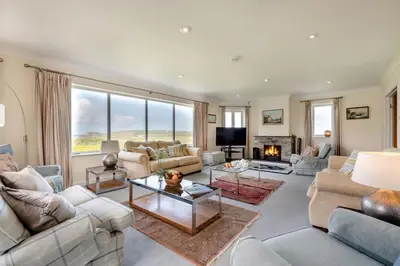 a large living room with couches and a fireplace at 6 Bed in Padstow oc-p00006 in St Merryn