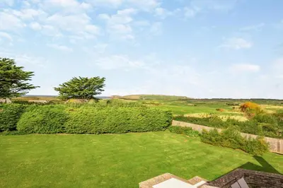 an aerial view of a yard with hedges at 6 Bed in Padstow oc-p00006 in St Merryn