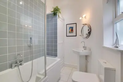 a bathroom with a shower toilet and a sink at 4 Bed in Fowey oc-nend in Fowey