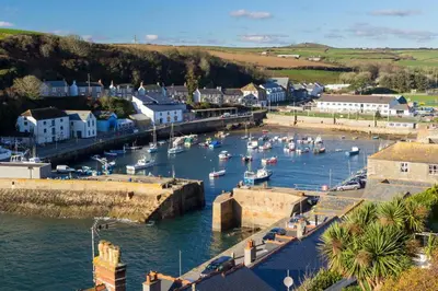 a harbor with boats in the water in a town at 2 Bed in Porthleven oc-nights in Porthleven