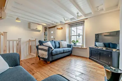 a living room with a couch and a tv at 2 Bed in Porthleven oc-nights in Porthleven