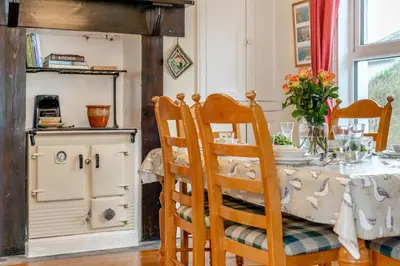 a dining room with a table and chairs at 3 Bed in Padstow oc-p00043 in St Merryn