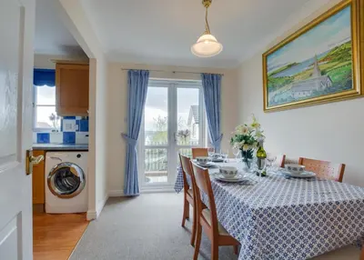 a kitchen and dining room with a table and chairs at 3 Bed in Wadebridge oc-p00093 in Wadebridge