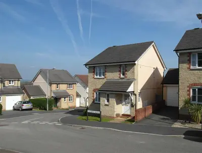 a row of houses on a street with a car at 3 Bed in Wadebridge oc-p00093 in Wadebridge