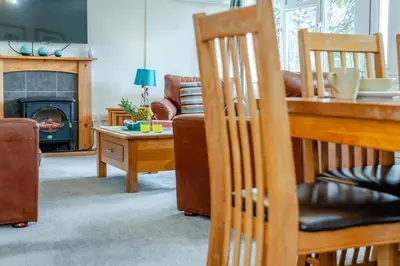 a living room with a couch and a table at 3 Bed in St. Merryn oc-p00114 in St Merryn