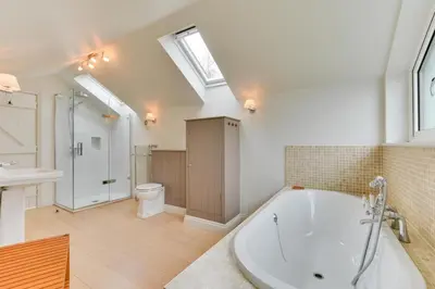 a bathroom with a tub and a toilet and a sink at 2 Bed in Padstow oc-p00082 in Padstow