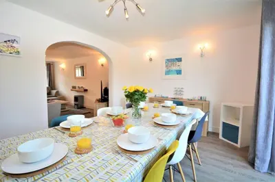 a dining room with a long table with chairs at 4 Bed in Padstow oc-p00184 in Padstow