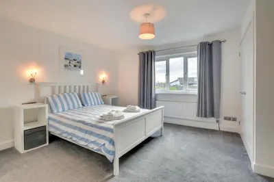 a bedroom with a bed and a window at 4 Bed in Padstow oc-p00184 in Padstow