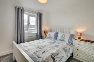 a bedroom with a bed and a window and a dresser at 4 Bed in Padstow oc-p00184 in Padstow