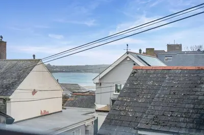 a view of the roofs of houses and the water at 3 Bed in Padstow oc-p00175 in Padstow