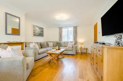 a living room with a couch and a tv at 3 Bed in Padstow oc-p00175 in Padstow