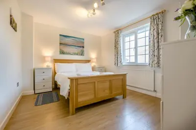 a bedroom with a bed and a window at 3 Bed in Padstow oc-p00175 in Padstow