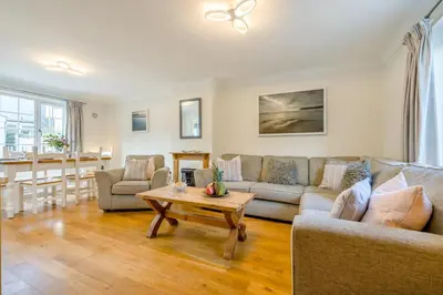 a living room with a couch and a table at 3 Bed in Padstow oc-p00175 in Padstow