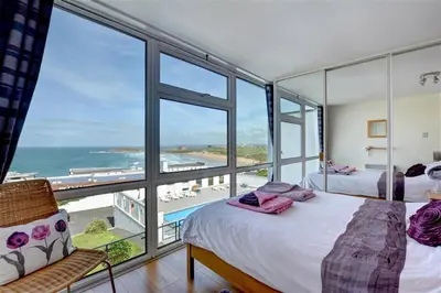 a bedroom with two beds and a view of the ocean at 2 Bed in Newquay oc-p00214 in Newquay
