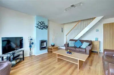 a living room with a couch and a table at 2 Bed in Newquay oc-p00214 in Newquay