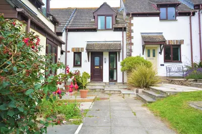a house with a pathway leading to the front door at 2 Bed in Padstow oc-p00183 in Padstow