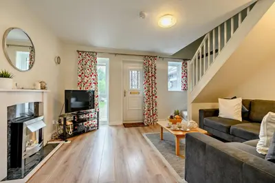 a living room with a couch and a tv at 2 Bed in Padstow oc-p00183 in Padstow