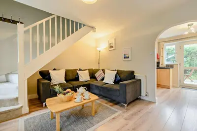 a living room with a couch and a table at 2 Bed in Padstow oc-p00183 in Padstow