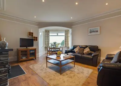 a living room with a couch and a table at 2 Bed in Padstow oc-p00134 in Padstow