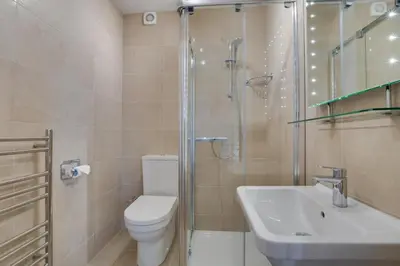 a bathroom with a toilet and a shower and a sink at 2 Bed in Padstow oc-p00134 in Padstow