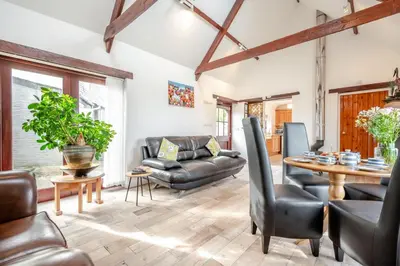 a living room with a couch and a table at 2 Bed in Padstow oc-p00249 in Padstow