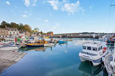 a bunch of boats are docked in a harbor at 3 Bed in St. Merryn oc-p00251 in St Merryn