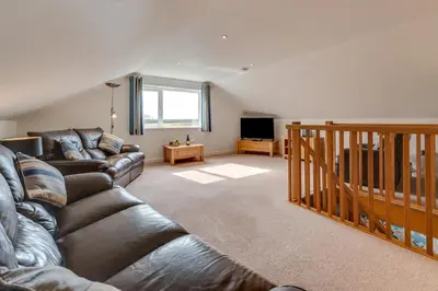 a living room with a couch and a television at 3 Bed in St. Merryn oc-p00251 in St Merryn
