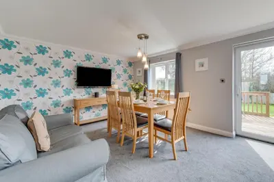 a living room with a table and a tv at 3 Bed in St. Merryn oc-p00251 in St Merryn