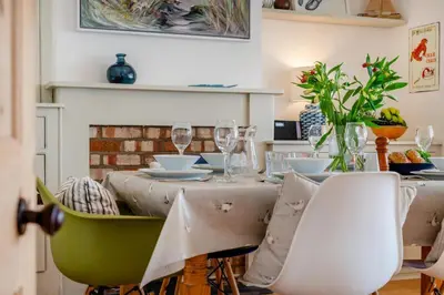 a dining room with a table with wine glasses at 3 Bed in Padstow oc-p00144 in Padstow