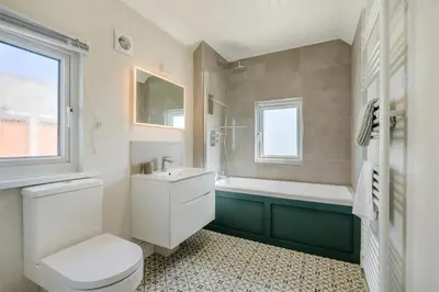 a bathroom with a toilet and a sink and a tub at 3 Bed in Padstow oc-p00144 in Padstow