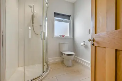a bathroom with a toilet and a glass shower at 3 Bed in Padstow oc-p00144 in Padstow