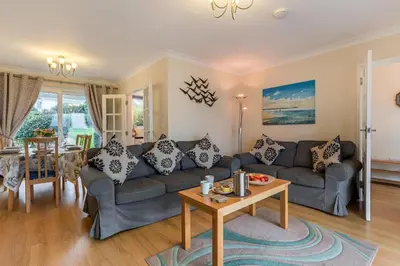 a living room with a couch and a table at 3 Bed in Padstow oc-p00226 in Padstow