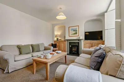a living room with a couch and a table at 4 Bed in Padstow oc-p00297 in Padstow